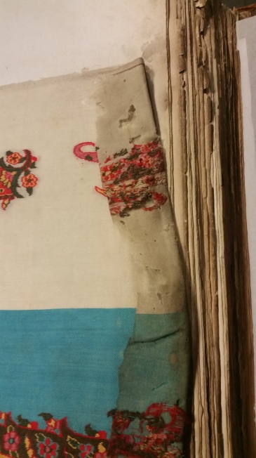 Image showing damage to textiles in a Board of Trade book